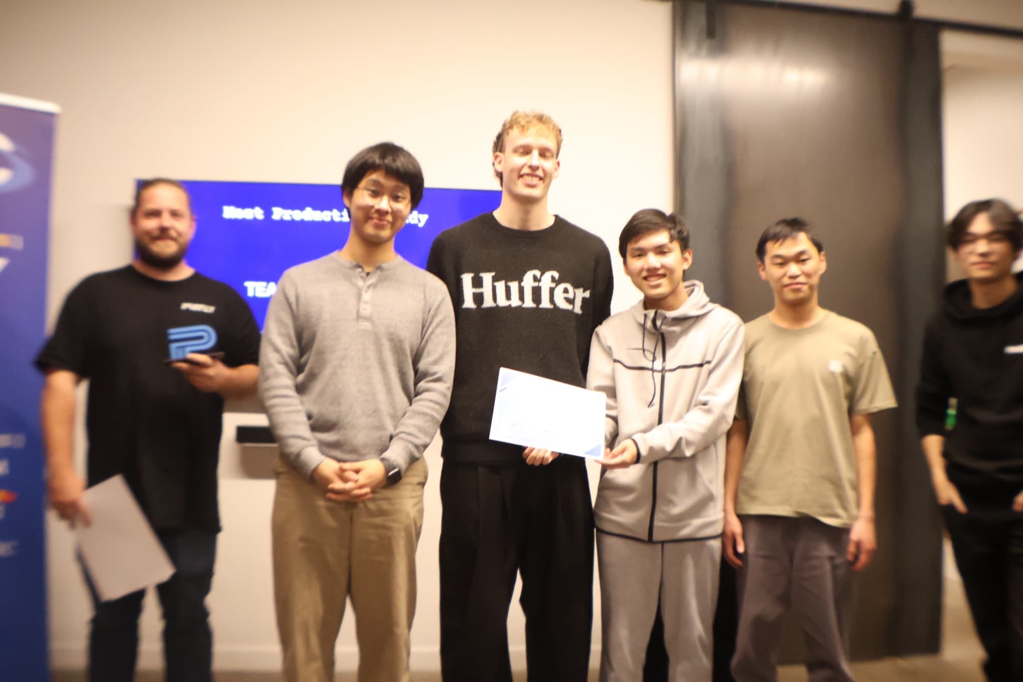 Our team on stage holding the Most Production Ready certificate