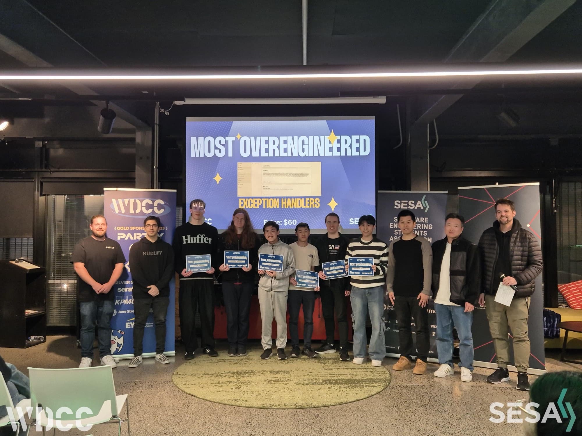 All the winning teams in front of the Most Overengineered slide
